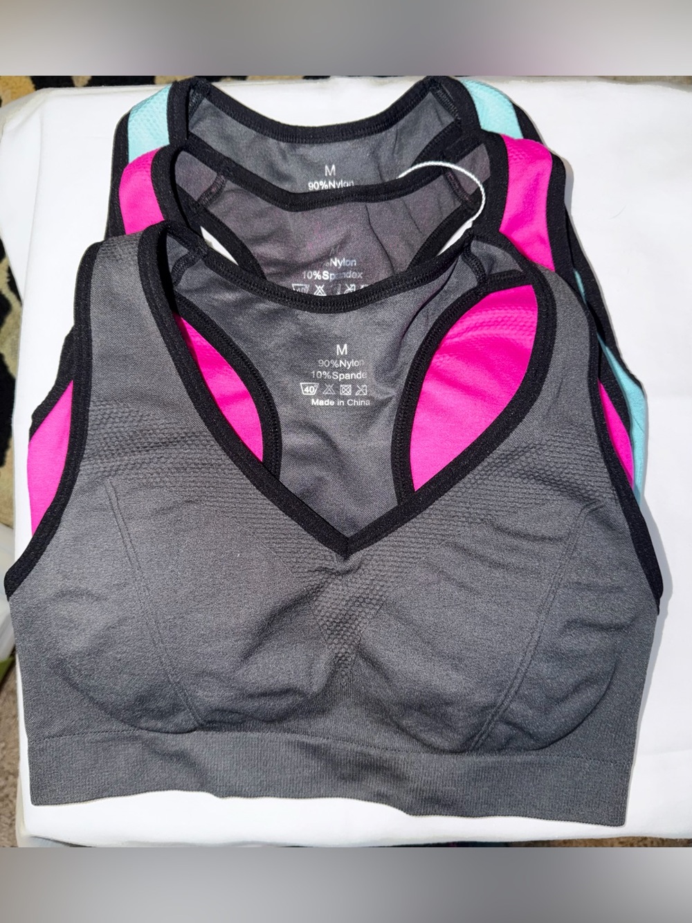 Set of 3 Women's Sports Bras - Gray, Pink and Mint.